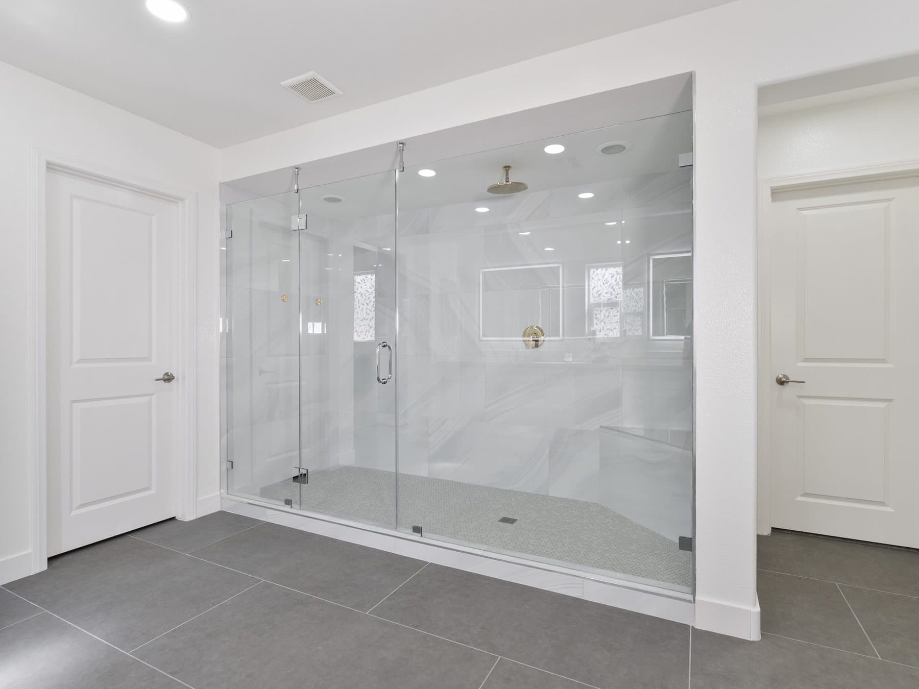 Lone Mountain bathroom remodel: walk-in shower with full-width glass