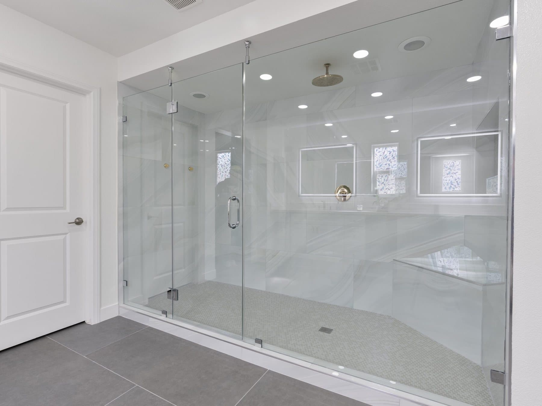 Lone Mountain bathroom remodel: walk-in shower and gray tile flooring