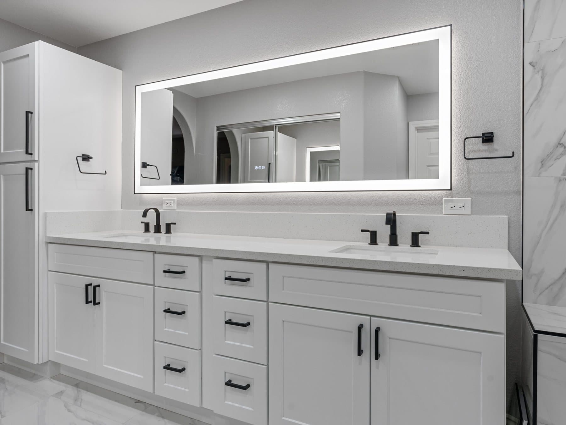 Summerlin bathroom remodel: double vanity with full-width illuminated mirror
