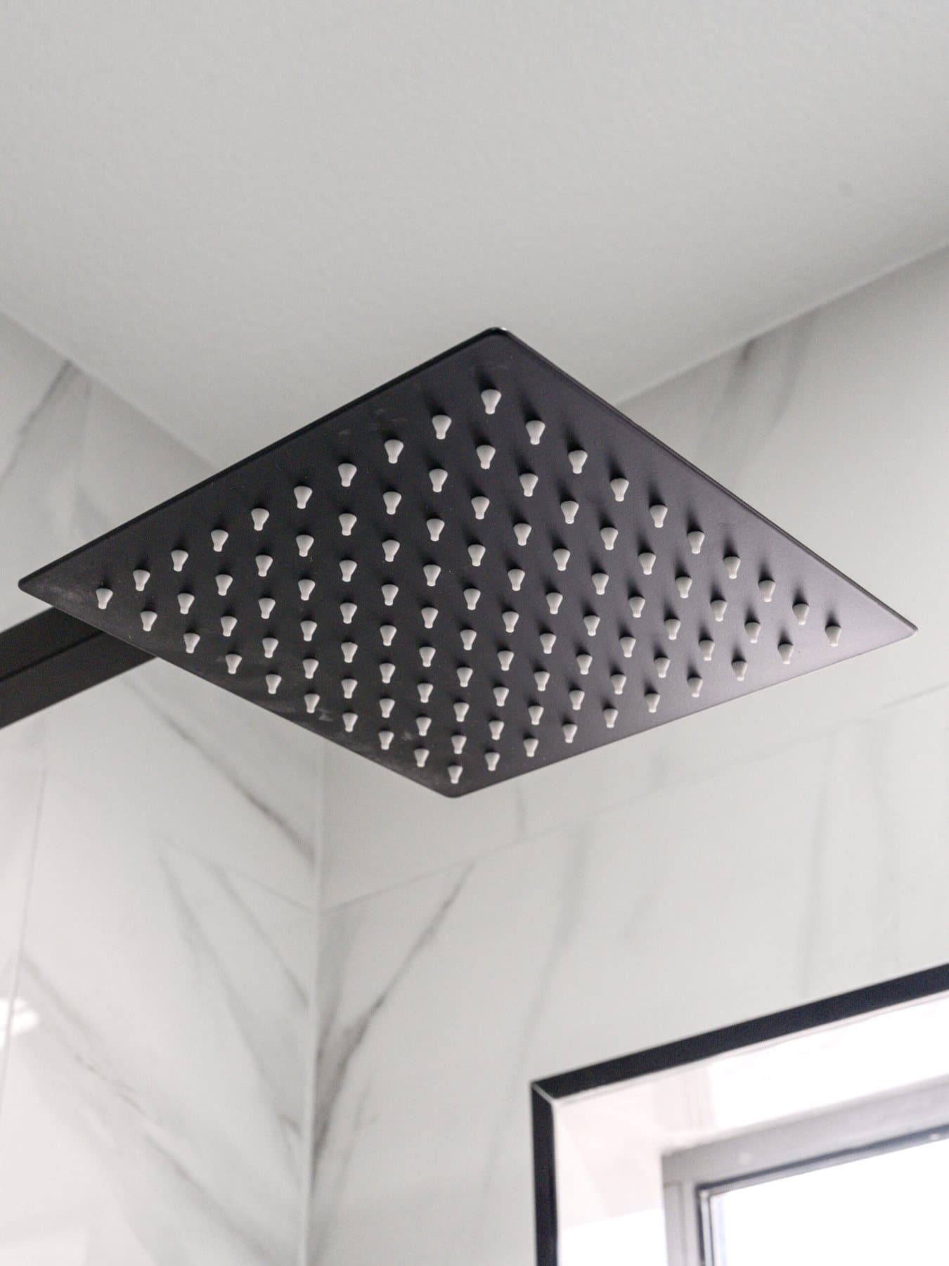 Summerlin bathroom remodel: matte-black rain shower head