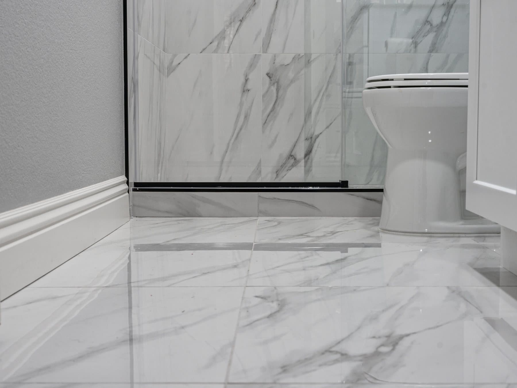 Summerlin bathroom remodel: marble-look large-format floor tile