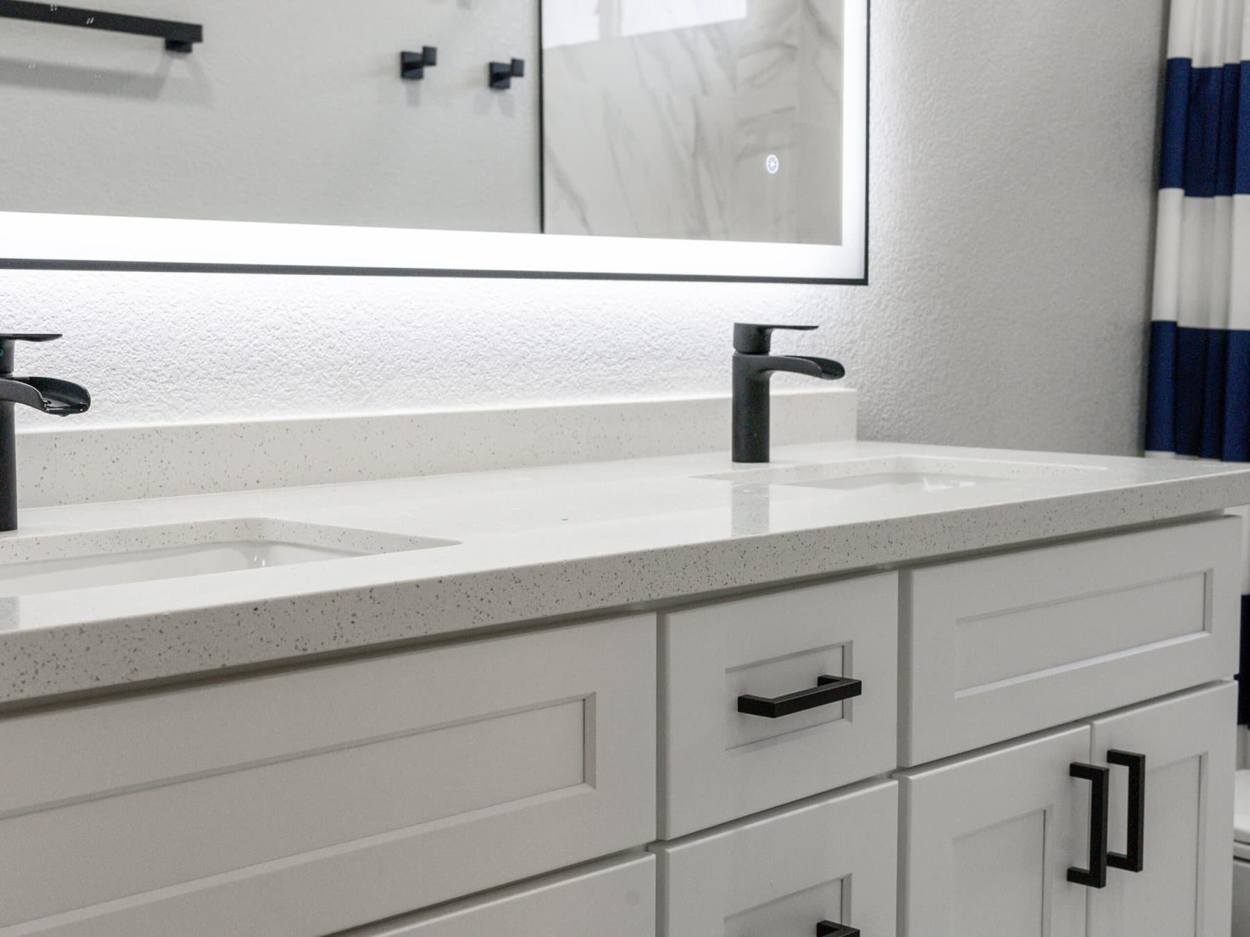 Summerlin bathroom remodel: white shaker vanity with matte-black pulls