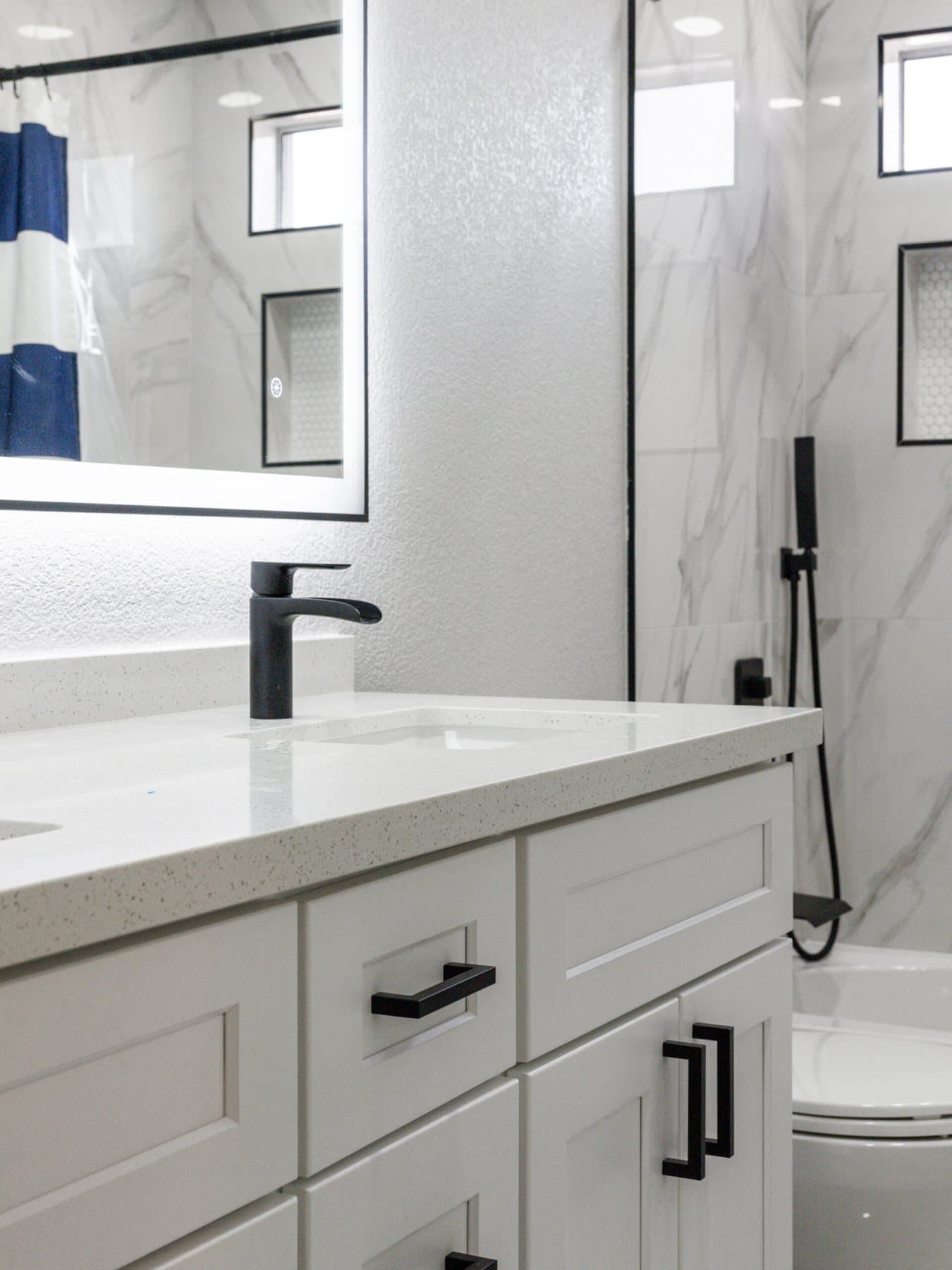 Summerlin bathroom remodel: vanity with matte-black faucet and hardware
