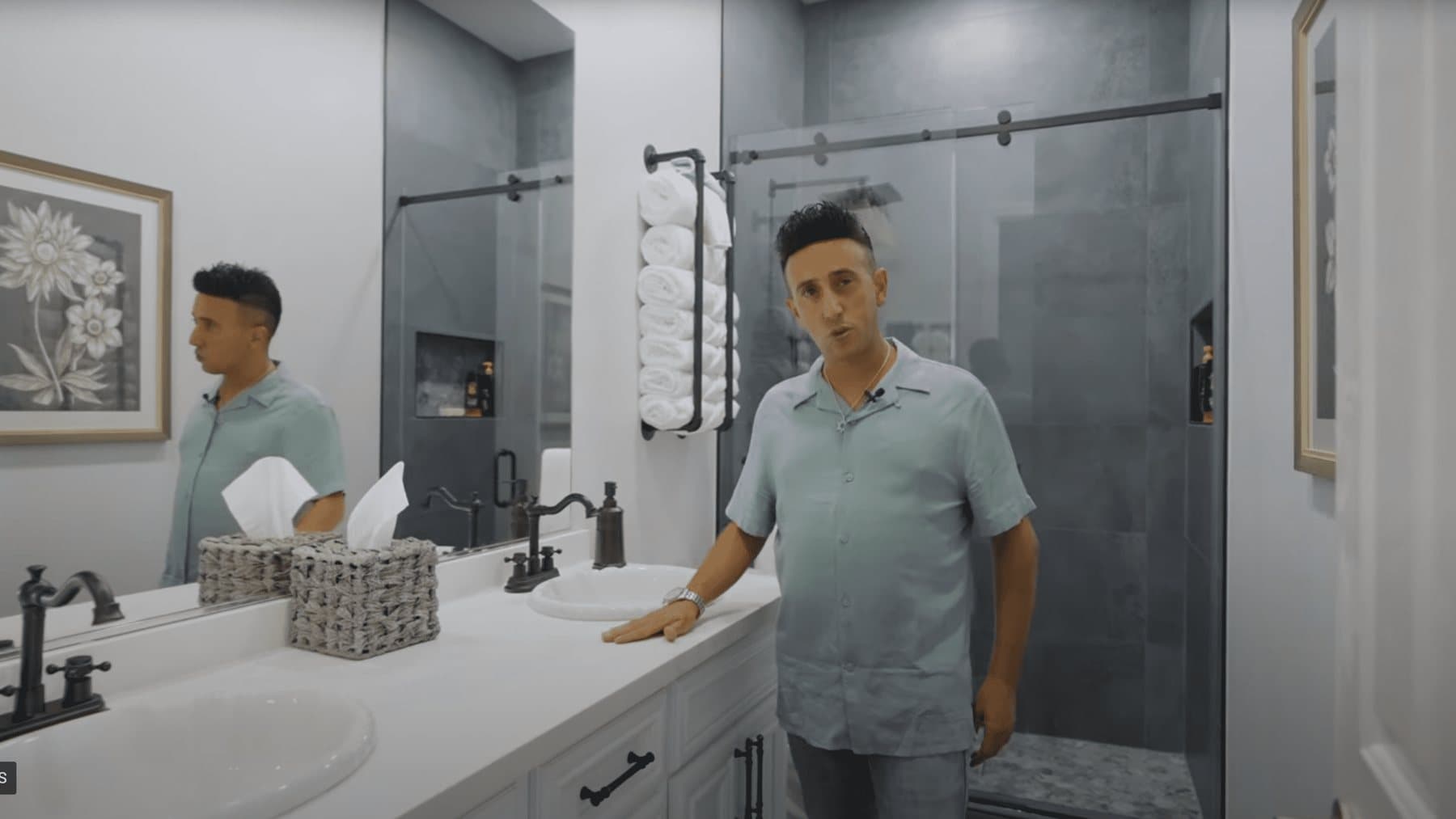 Eran Tsur presenting a finished bathroom remodel